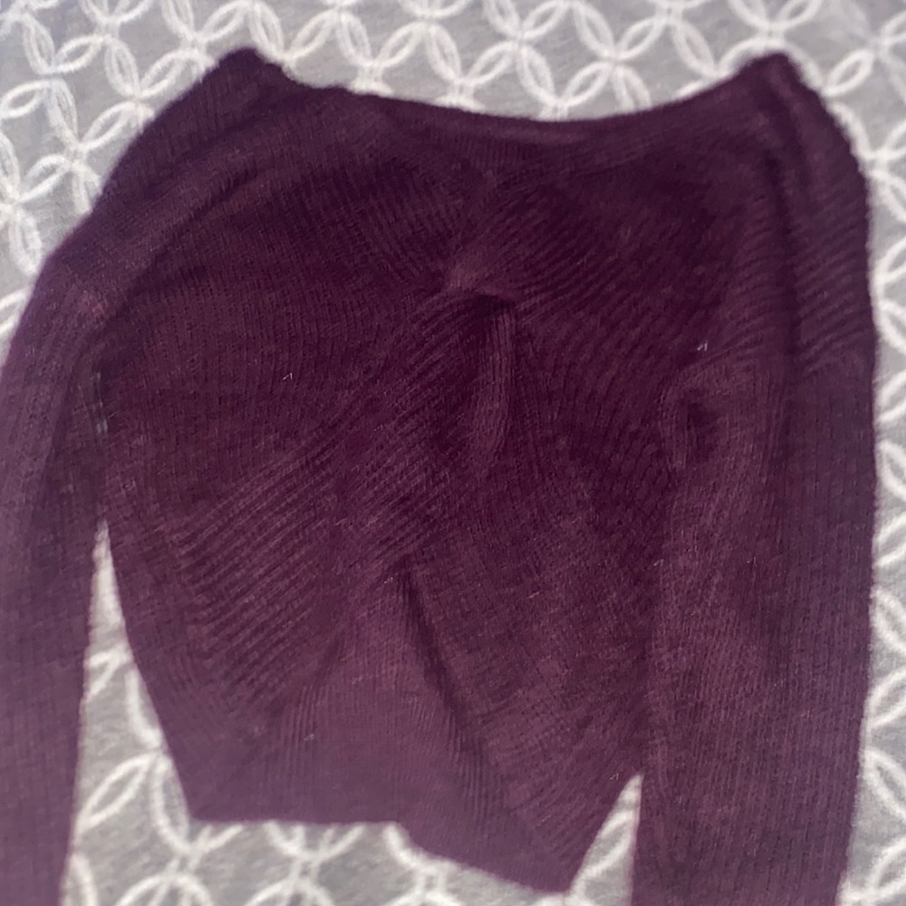 A maroon sweater